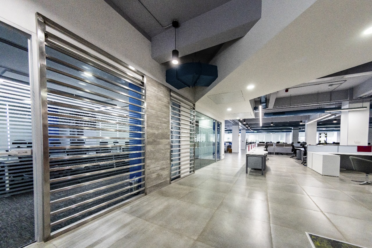 Glazed office corridor showing partitions, ceiling and lighting in Blue Beam project photography